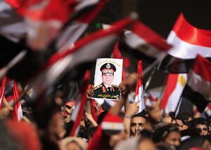 Protesters in Tahrir Square with a portrait of the Minister of Defense Abdel Fattah al-Sisi